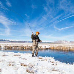Man fishing in Owens River During Winter