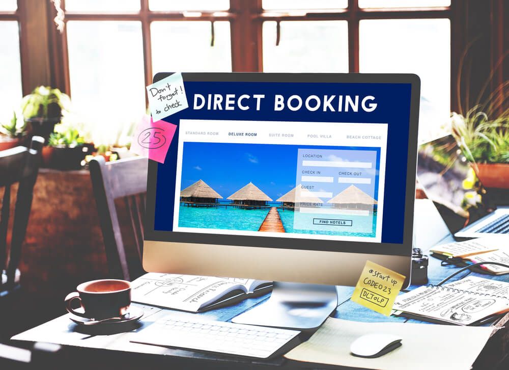 Photo of computer displaying travel sites with direct booking