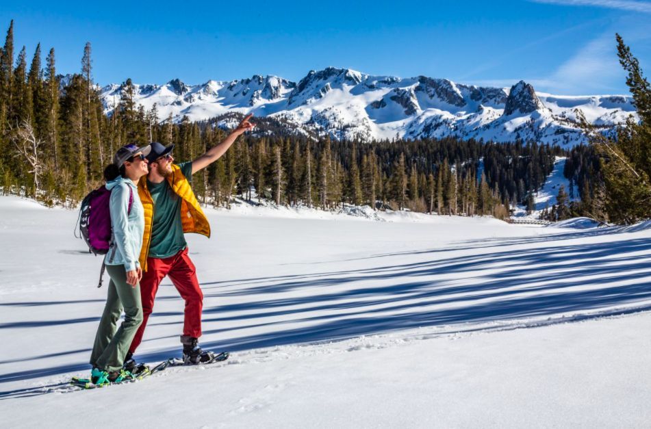 Photo of couple enjoying spring snowshoeing during Mammoth Lakes in May